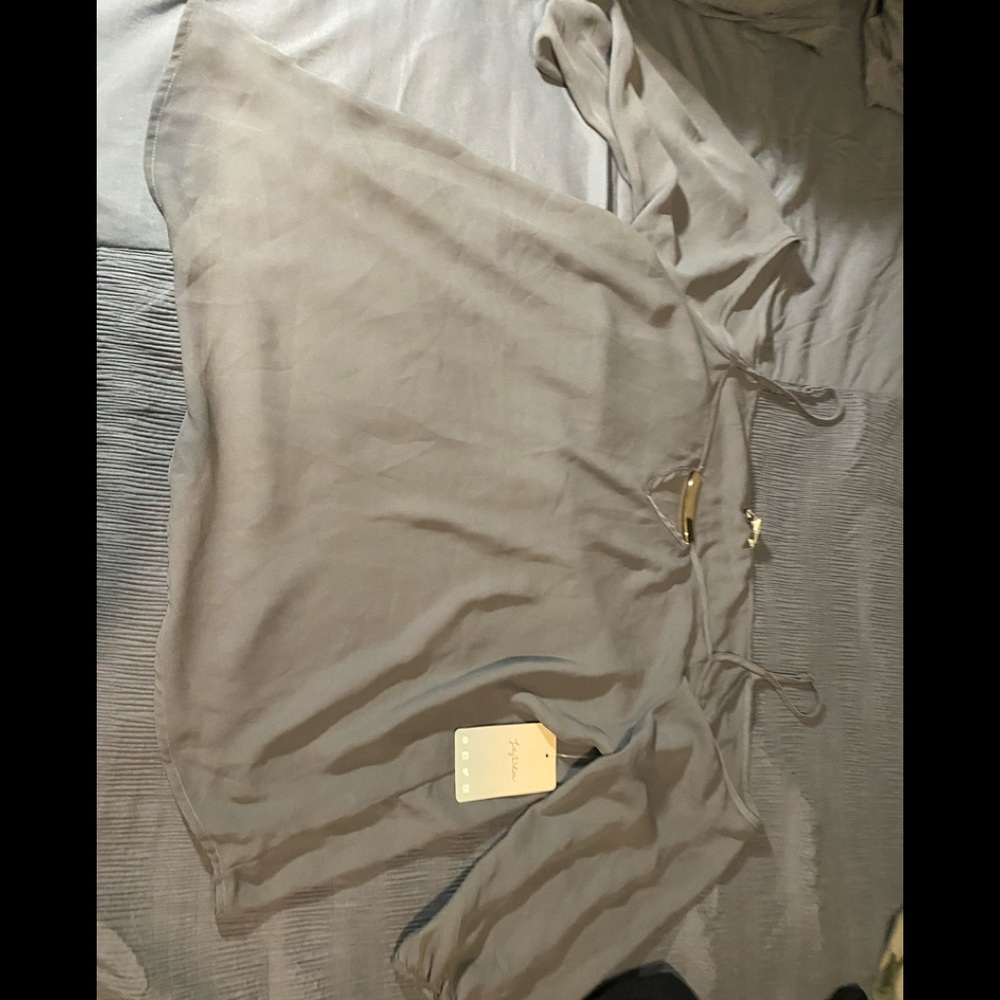 Grey off thaw shoulder top with spaghetti straps and a hardware detail.